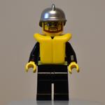 Fireman, Black Fire Jacket with Reflective Stripes, Radio, and Badge, Silver Helmet, Yellow Life Vest 2610, Beard and Glasses